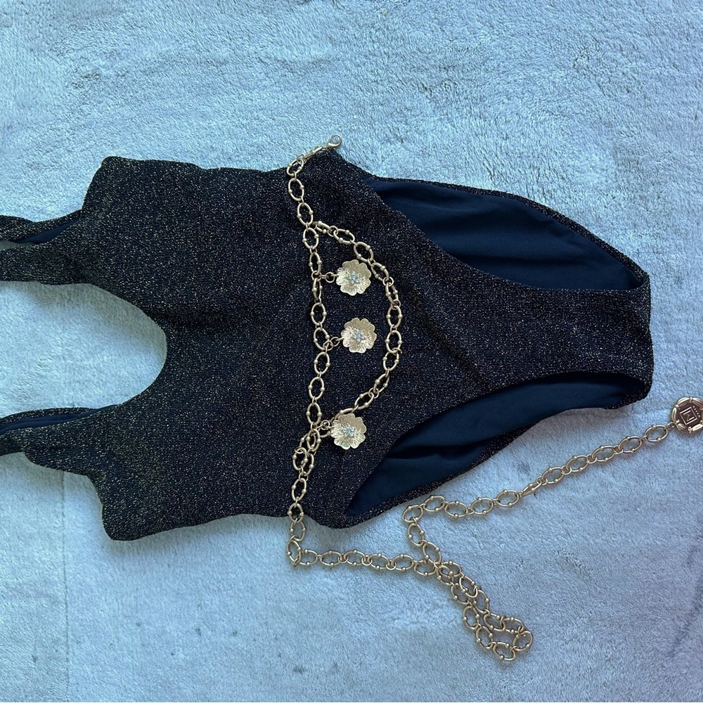Worn once! One piece, black, shimmer bathing suit with chain included